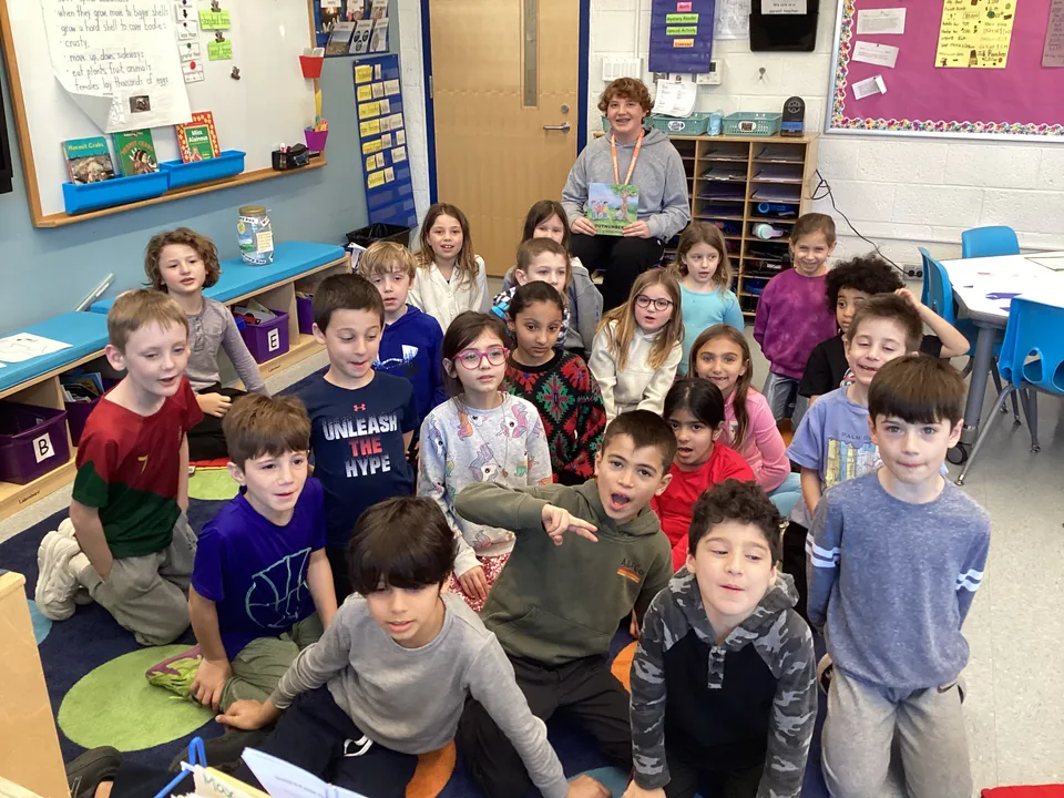 Author Zachary Penan reading Outnumbered to a classroom of children